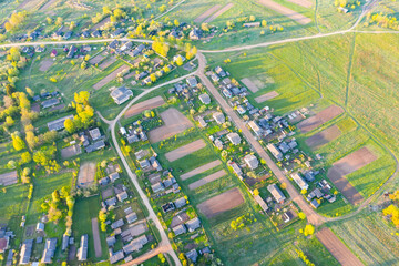 Aerial view of typical village and farm fields.