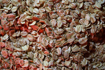 macro photography on the background of oatmeal. oatmeal close-up on a red background