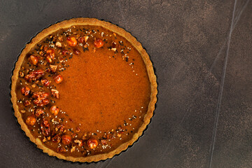 Caramel pecan pumpkin pie, the topping perfectly toasted, offers a twist on the traditional Thanksgiving favorite