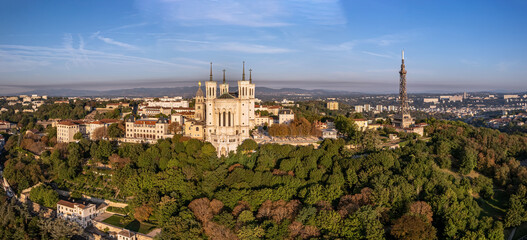 The drone panoramic view of The Basilica of Notre-Dame de Fourvière and Metallic tower on the top of hill, Lyon, France.