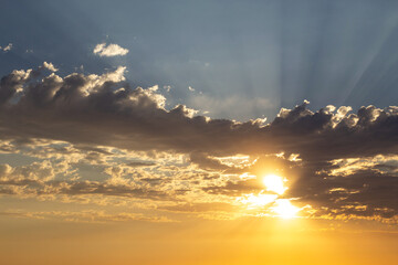 beams of sun light poking through the clouds