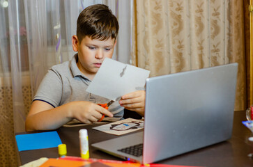 Fototapeta na wymiar child is engaged on laptops distance learning