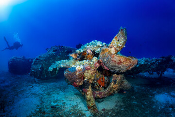 A sunken world war two fighter propeller airplane at the seabed of the Aegean Sea with a...