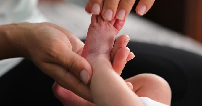 baby foot massage. Baby feet in mother s hands. Childcare happy childhood