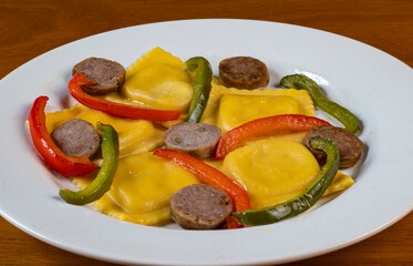 four cheese ravioli  with sweet italain sausage  and peppers