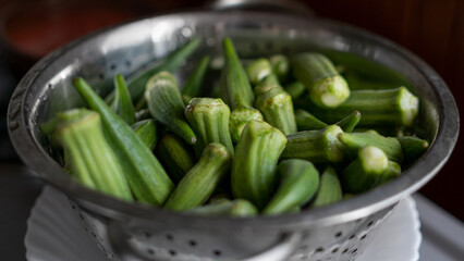Top view of green fresh okra (known as gumbo or ladies' fingers) ready to cook. Turkish traditional Ramadan food.