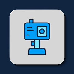 Filled outline Action extreme camera icon isolated on blue background. Video camera equipment for filming extreme sports. Vector