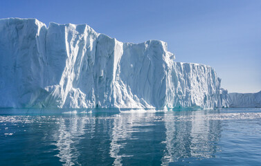 Towering great icebergs in the Ilulissat Icefjord in Greenland