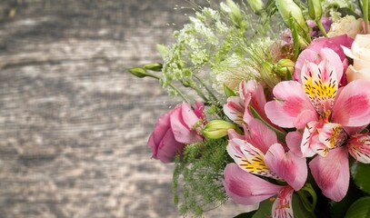 Colorful wild flower bouquet on wooden table