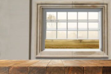 Fototapeta premium Desk of free space and autumn window background. 