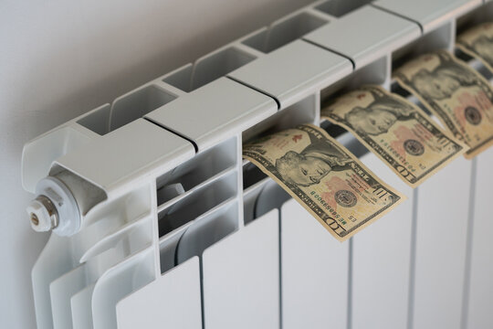 Dollar Banknotes Lie On Room Central Heating Radiator In Apartment. Money Put To Dry After Accidentally Soaking In Water. Owner Of Property Puts Wet Money On Battery Preventing Falling Into Disrepair