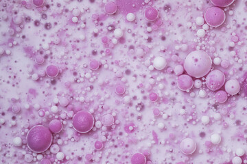 Top view pink oil bubbles abstract texture. Multicolored surface