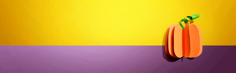 Paper craft autumn pumpkin overhead view - flat lay