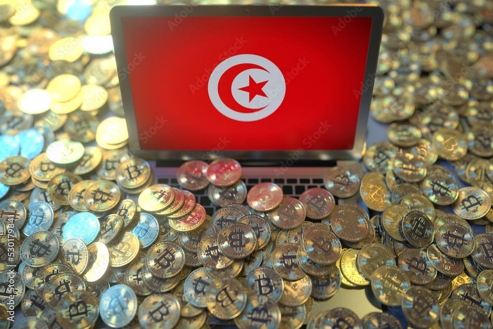 Aufkleber computer with flag of tunisia and pile of bitcoins. national regulations and cryptocurrency mining c