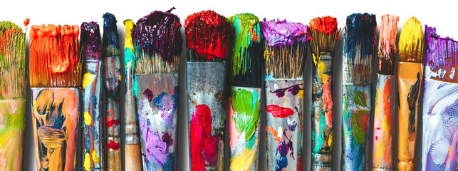 Row of artist paintbrushes closeup. Artistic brushes smeared with paints, isolated. - obrazy, fototapety, plakaty