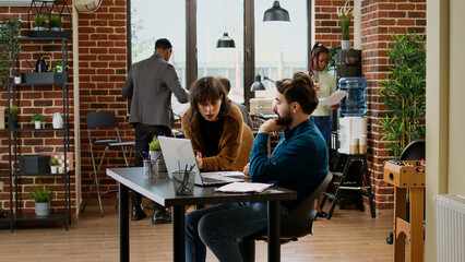 Timelapse of business people working on laptop in company office, doing collaboration with data...