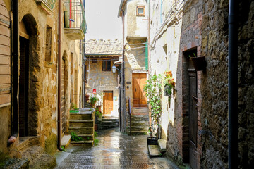 Fototapeta na wymiar Narrow street on a spring day in small town Pitigliano, Tuscany