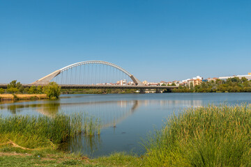 Fototapeta na wymiar Guadiana river in the city of Merida and the Lusitania bridge, Extremadura. Spain