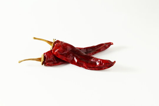 dry organic kashmiri red chili pepper well known for dark red color food recepi in indian gujarati food isolated on white background,selective focus
