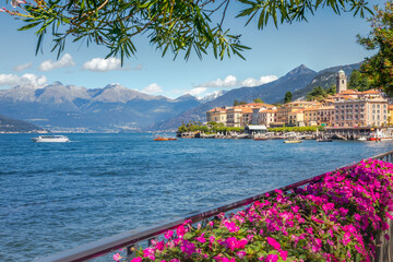 Mountains and Bellagio skyline, view from Lake Como at sunny day, northern Italy