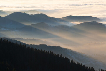 Mala Fatra mountain range shrouded in low clouds, Slovakia.