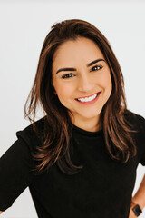 Headshot of young professional female smiling at camera