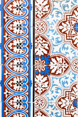 Ornamental tiles in brown and blue tones 