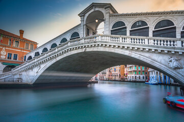 Rialto bridge at peaceful dramatic dawn and Grand Canal, Venice, Italy
