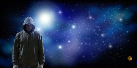 Fototapeta na wymiar Silhouette of man in hoody on space and stars background