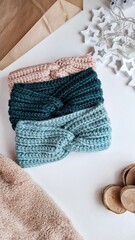 Fashionable knitted headbands autumn-winter. The headbands lies on a white background. Product layout. Knitting. Hobby.