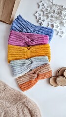 Fashionable knitted headbands autumn-winter. The headbands lies on a white background. Product layout. Knitting. Hobby.