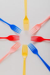 Set of Multicolored plastic forks in symmetric shape
