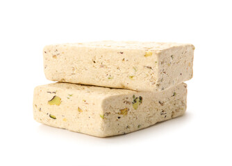 Pieces of delicious sesame halva on white background