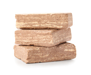 Pieces of tasty sesame halva isolated on white background