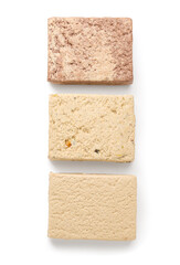 Pieces of tasty sesame halva isolated on white background