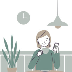 カフェでスマートフォンを見る女性
