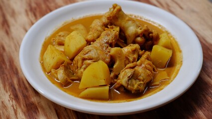 Gulai ayam dan kentang. Indonesian chicken curry with potato. Is traditional side dish from Minangkabau cuisine