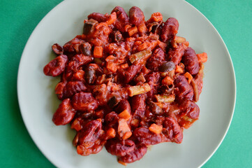 Beetroot gnocchi with black olives and mixed vegetables