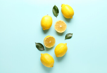 Composition with lemons and leaves on color background