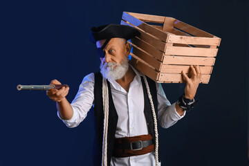 Old pirate with rope, spyglass and box on dark background