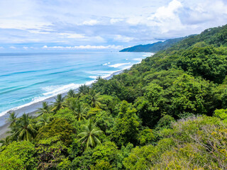 Aerial of corcovado beach in Costa Rica Osa Peninsula showing how the wild pacific meets the...