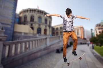 Young skateboarder ride in modern city