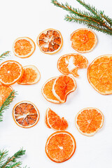 Christmas background. Dried oranges and spruce branches. minimalistic new year background 2023