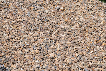 large pile of washed up small stones close up