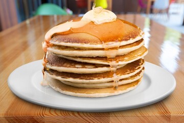 Homemade pancake with oil on white plate. Concept butter pancake.