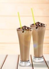 Coffee in glass with cream and milk. Summer drinks