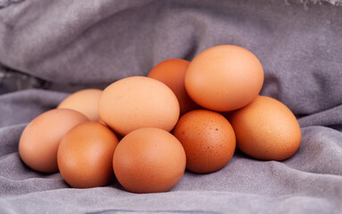 chicken eggs put on fabric gray