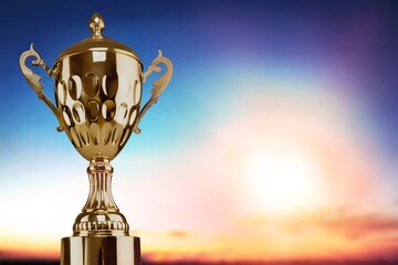 Naklejka premium Golden winner trophy on dark sky background
