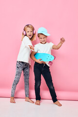 a boy in a cap and a girl happy faces blue studio