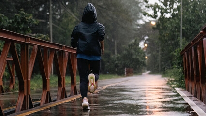 Asian ladies running in the rain